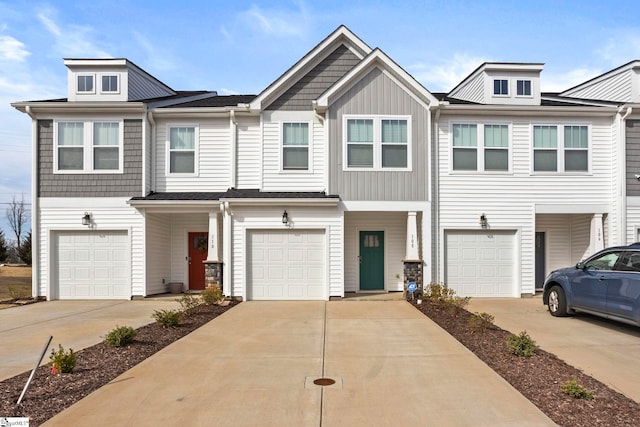 view of property with driveway and an attached garage