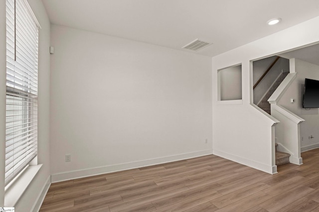 108 Marston Ln, Greenville, SC 29617 - unfurnished room with light wood-style flooring, visible vents, stairway, and baseboards