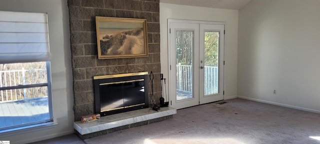 144 Amber Dr, Inman, SC 29349 - unfurnished living room with carpet floors, french doors, a fireplace, and baseboards