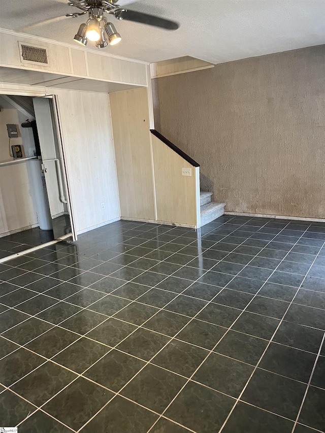 144 Amber Dr, Inman, SC 29349 - unfurnished living room featuring dark tile patterned flooring, stairway, visible vents, and a ceiling fan