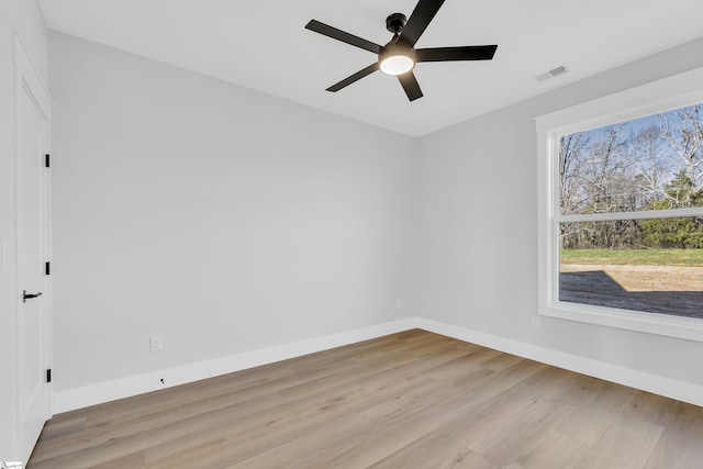 794 Hebron Church Rd, Iva, SC 29655 - unfurnished room featuring light wood finished floors, baseboards, visible vents, and ceiling fan