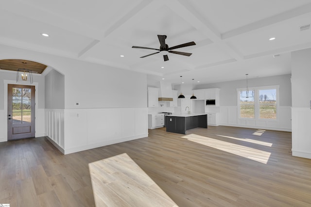 794 Hebron Church Rd, Iva, SC 29655 - unfurnished living room featuring plenty of natural light, arched walkways, and coffered ceiling