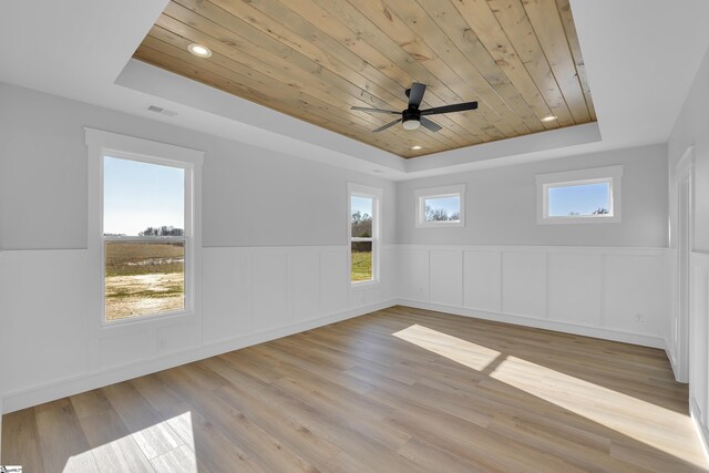 794 Hebron Church Rd, Iva, SC 29655 - unfurnished room featuring wooden ceiling, a raised ceiling, a wealth of natural light, and wood finished floors