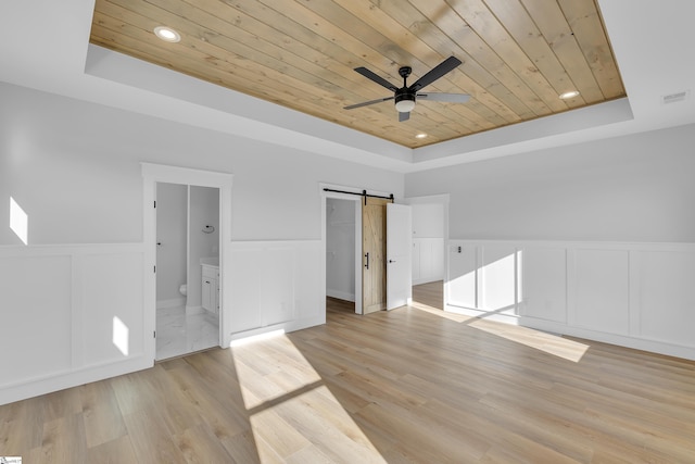 794 Hebron Church Rd, Iva, SC 29655 - empty room featuring a barn door, wooden ceiling, recessed lighting, a ceiling fan, and a tray ceiling