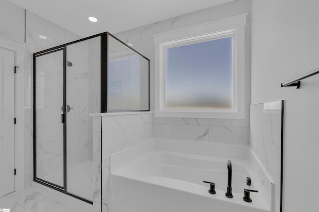 bathroom featuring recessed lighting, marble finish floor, a shower stall, and a bath