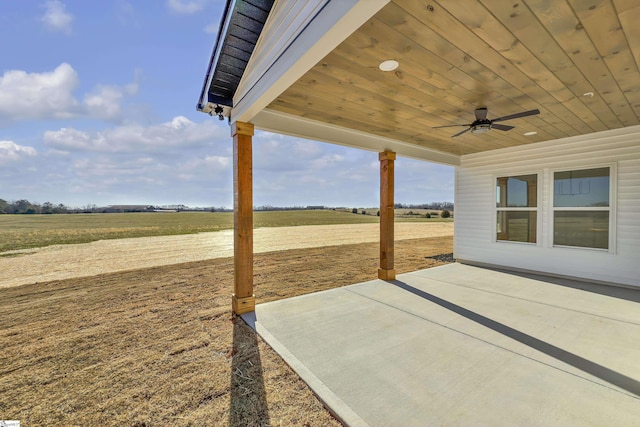 view of patio / terrace featuring a rural view and ceiling fan