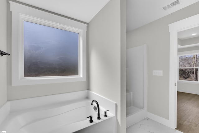 bathroom with marble finish floor, a garden tub, visible vents, a stall shower, and baseboards