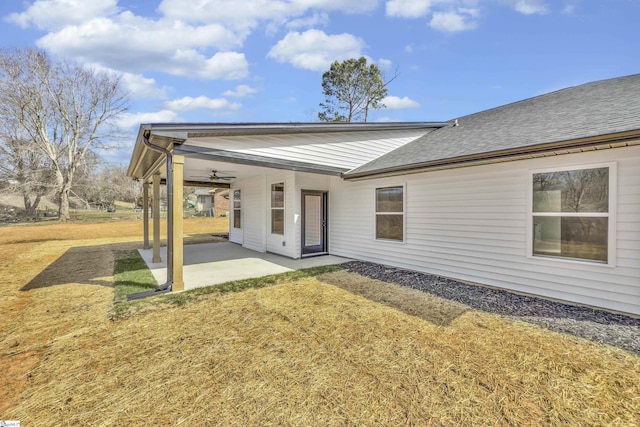 back of house featuring a yard, roof with shingles, a patio, and ceiling fan