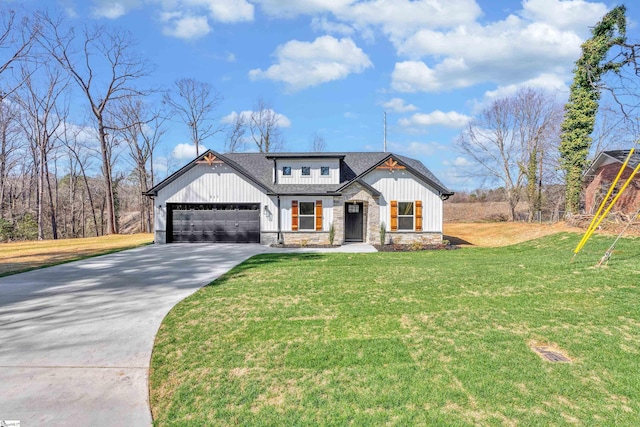 modern inspired farmhouse featuring a shingled roof, concrete driveway, a front yard, a garage, and stone siding