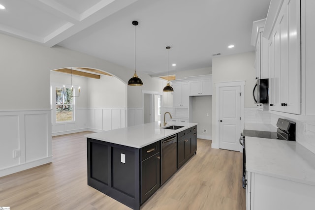 kitchen featuring electric stove, white cabinets, a sink, dark cabinetry, and dishwasher