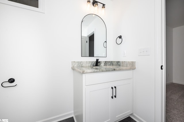 bathroom featuring vanity and baseboards