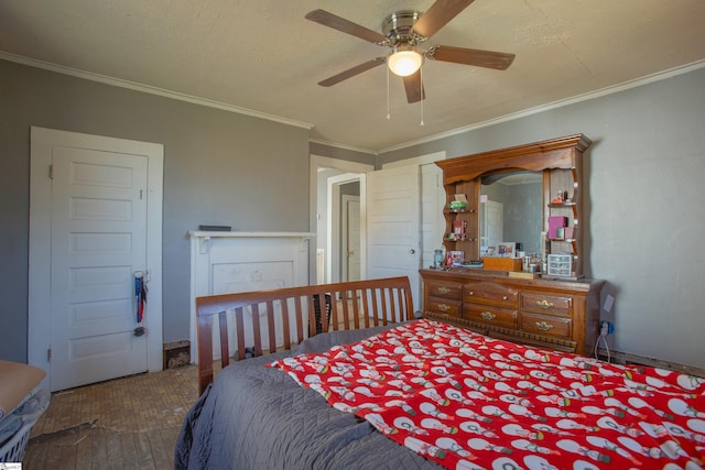 bedroom featuring ceiling fan, crown molding, a textured ceiling, and hardwood / wood-style flooring