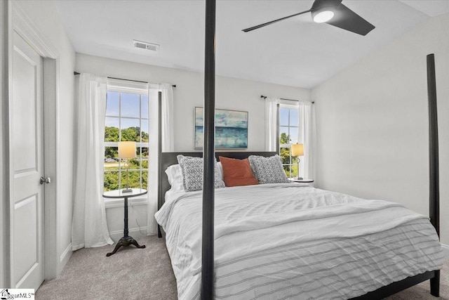 bedroom featuring carpet, visible vents, ceiling fan, and lofted ceiling