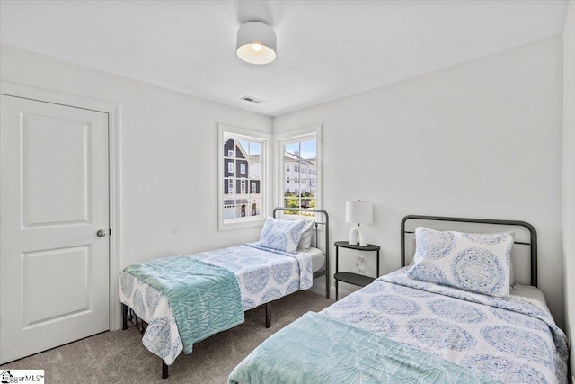 bedroom with carpet and visible vents