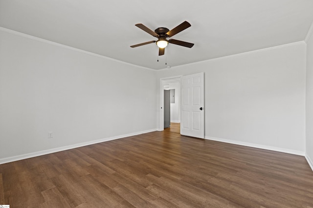 unfurnished room with crown molding, baseboards, and wood finished floors