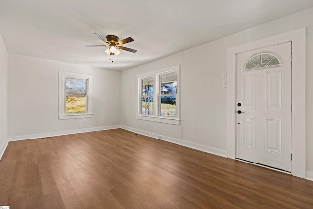 entryway featuring plenty of natural light, a ceiling fan, and wood finished floors