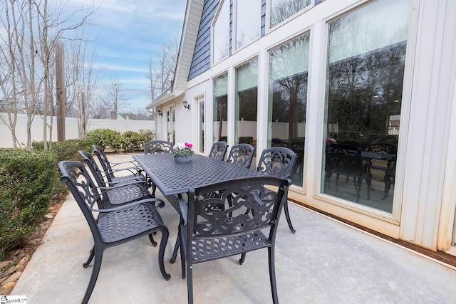 view of patio / terrace featuring outdoor dining space and fence