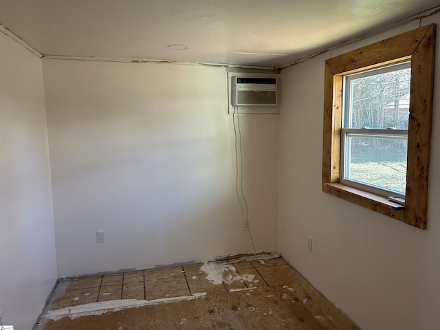 spare room featuring a wall mounted air conditioner