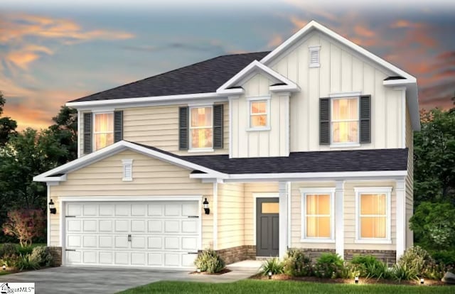 view of front of property with board and batten siding, concrete driveway, a shingled roof, and a garage