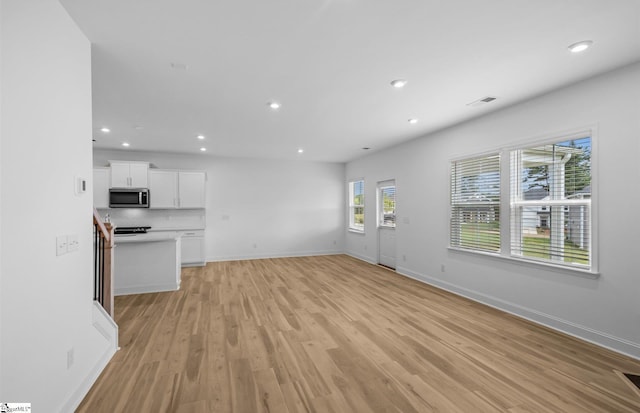 120 Indigo Cir Lot 35, Easley, SC 29642 - unfurnished living room with light wood finished floors, baseboards, and recessed lighting