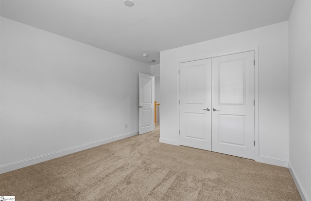 120 Indigo Cir Lot 35, Easley, SC 29642 - unfurnished bedroom with light carpet, baseboards, and a closet
