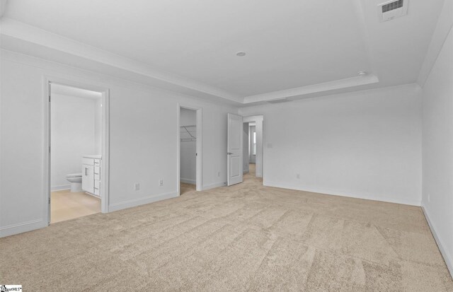 120 Indigo Cir Lot 35, Easley, SC 29642 - unfurnished bedroom with light colored carpet, a spacious closet, a tray ceiling, ornamental molding, and ensuite bathroom
