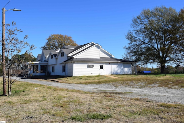 view of property exterior featuring a yard