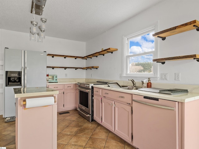 kitchen with white appliances, a center island, light countertops, a textured ceiling, and open shelves