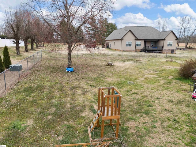 view of yard with a fenced backyard and a playground