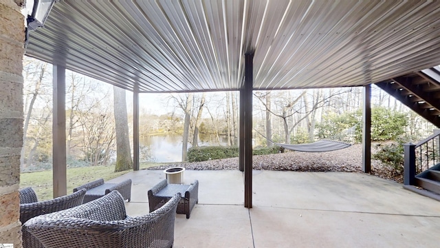 view of patio featuring a water view