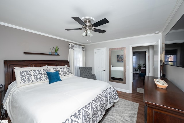 bedroom with ceiling fan, ornamental molding, dark wood finished floors, and baseboards