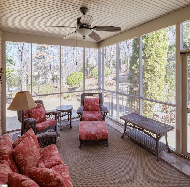 sunroom with a healthy amount of sunlight and a ceiling fan