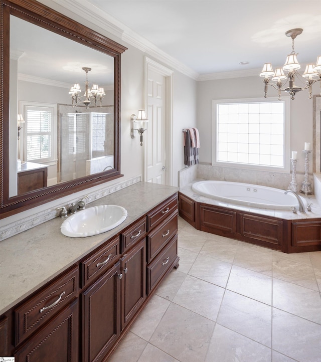 full bathroom featuring crown molding, vanity, a shower stall, a chandelier, and a bath