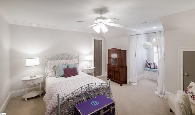 bedroom featuring light colored carpet, crown molding, and baseboards