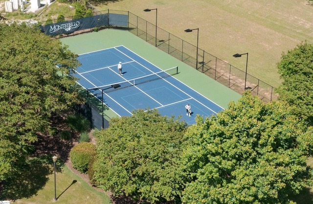 view of sport court with fence