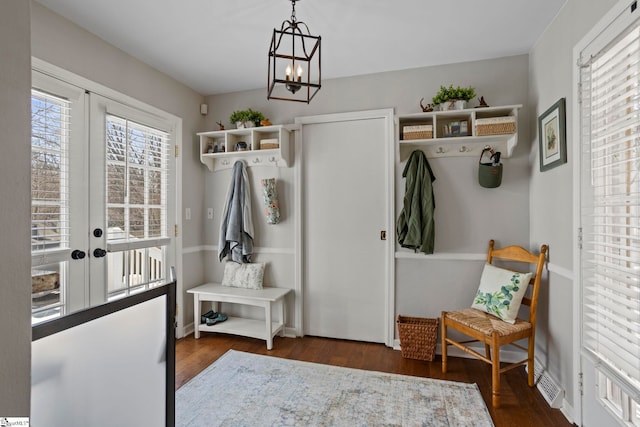 mudroom with visible vents, baseboards, wood finished floors, an inviting chandelier, and french doors