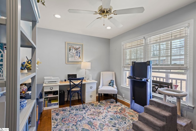 office space with baseboards, wood finished floors, a ceiling fan, and recessed lighting