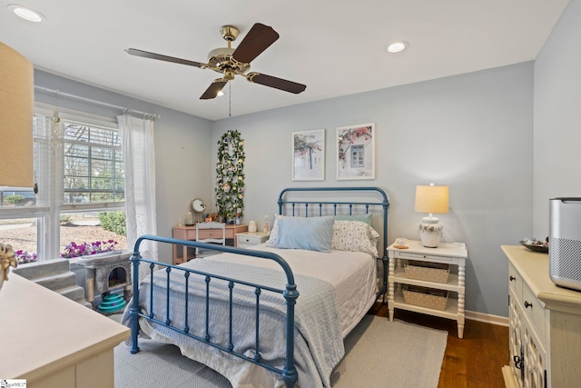 bedroom featuring recessed lighting, ceiling fan, baseboards, and wood finished floors