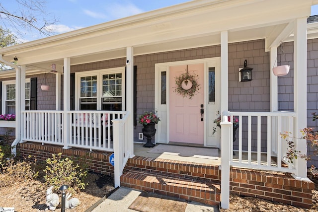 property entrance featuring covered porch