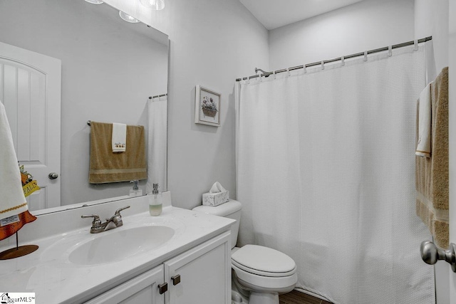 full bathroom featuring toilet, shower / bathtub combination with curtain, and vanity