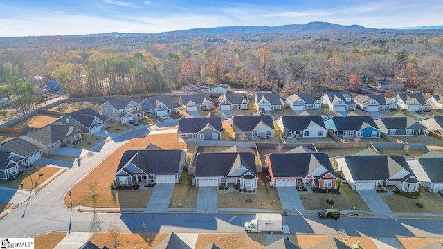 birds eye view of property with a residential view and a view of trees