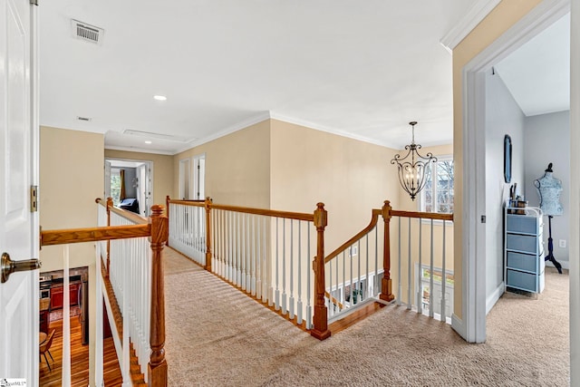 621 Shefwood Dr, Easley, SC 29642 - hallway with ornamental molding, visible vents, a notable chandelier, and an upstairs landing