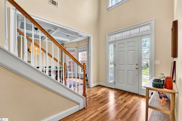 621 Shefwood Dr, Easley, SC 29642 - entrance foyer with a high ceiling, wood finished floors, visible vents, baseboards, and stairs