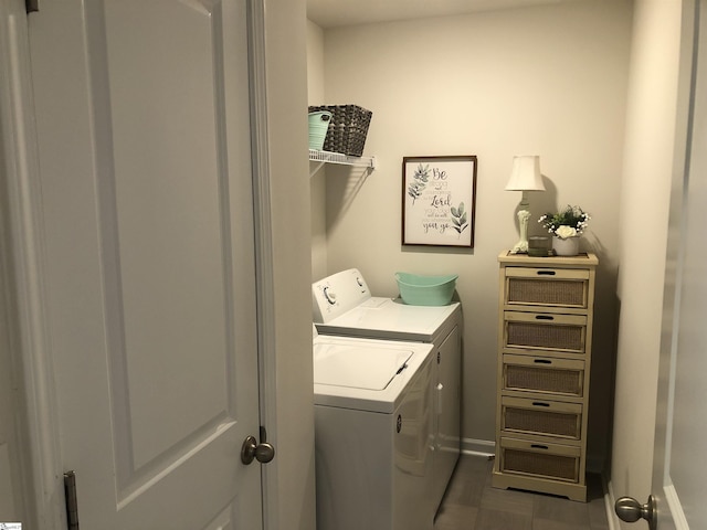 laundry room with laundry area, washer and clothes dryer, and baseboards