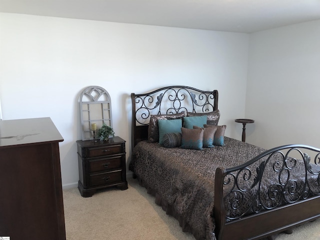 bedroom with light colored carpet