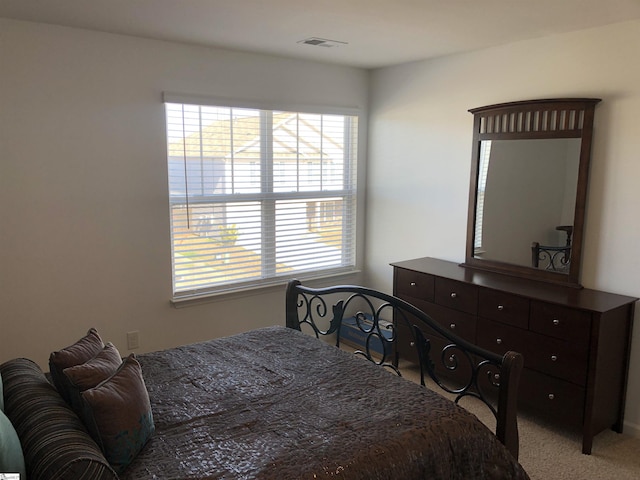 bedroom with carpet flooring and visible vents