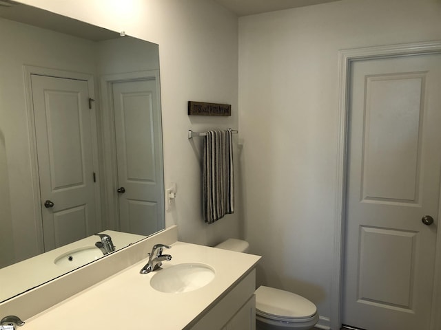 half bath with toilet and vanity