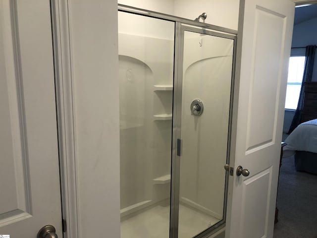 bathroom with a stall shower and ensuite bath