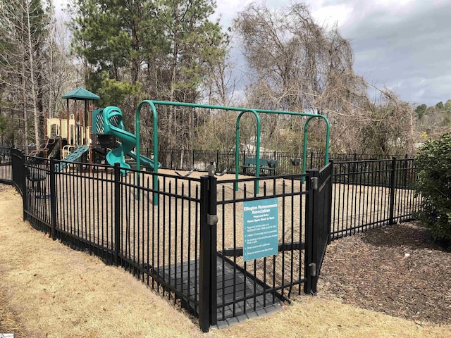 view of gate with fence