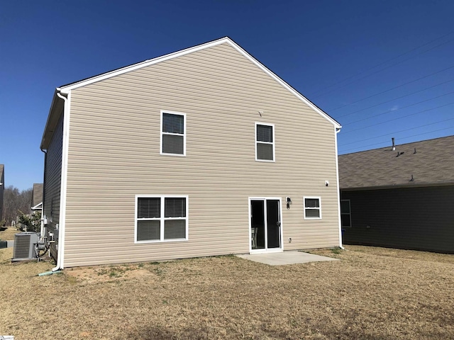 rear view of property featuring central air condition unit